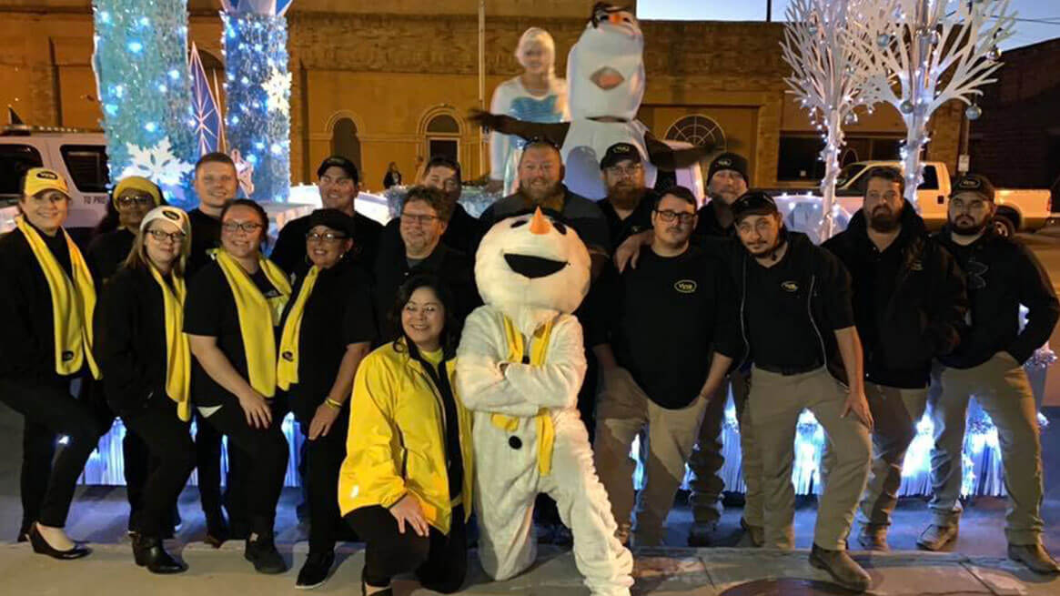 Vyve team posing with snowman during the Holidays