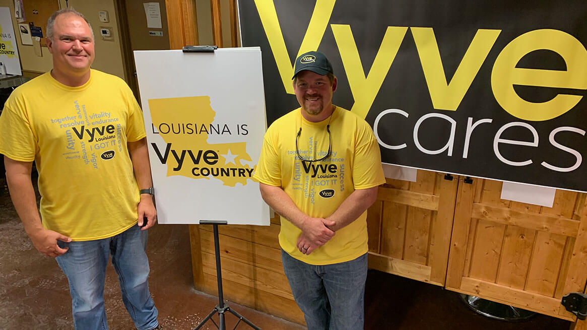 Vyve Technicians from Louisiana pose with Vyve Cares banner